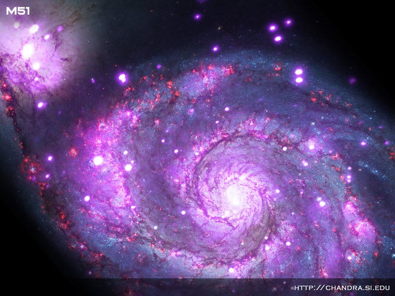 A galáxia Messier 51, fotografada pelo Observatório de Raios-X Chandra da NASA. Crédito: Raio X-: NASA / CXC / Wesleyan Univ./R.Kilgard, e outros; Óptico: NASA / STScI.